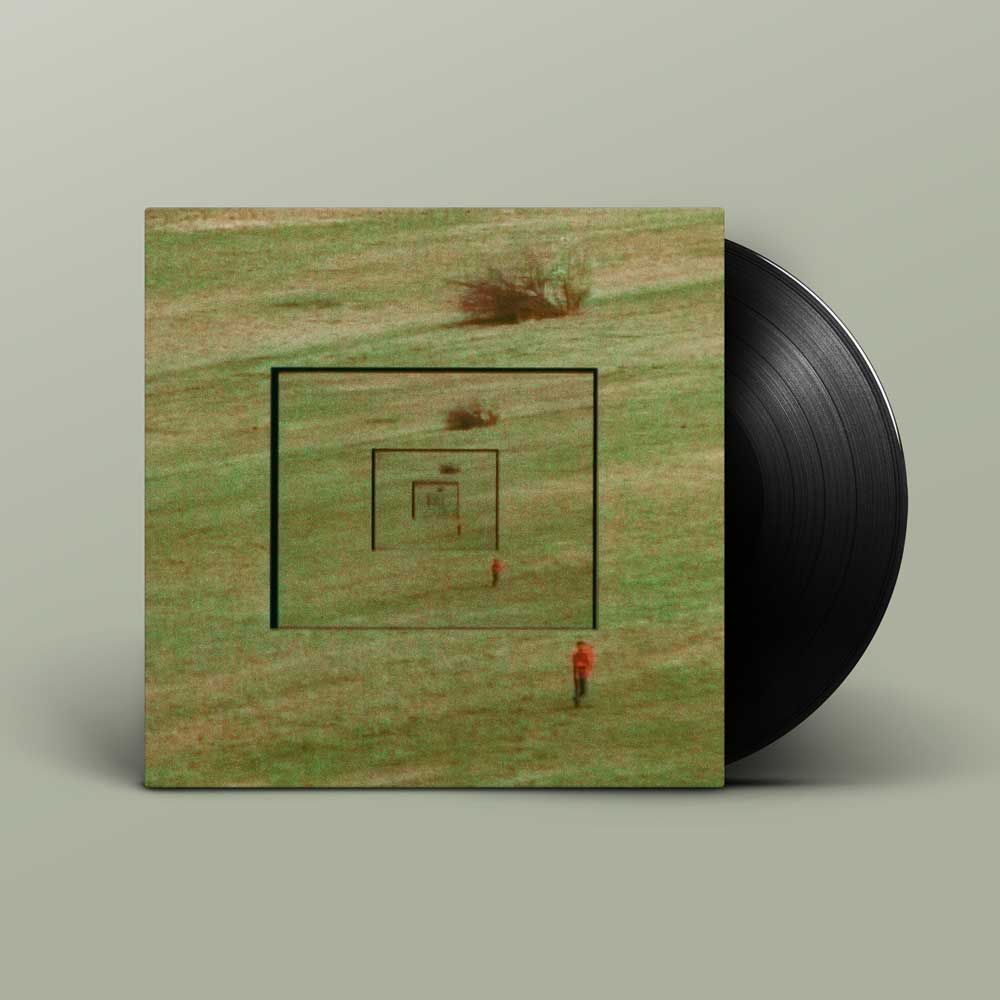 Bibio and Dorian Concept - Answers (Vinyl LP) A vinyl record partially pulled from its sleeve, showing the album cover artwork of a grassy field with concentric square lines and a small figure, against a muted grey background.