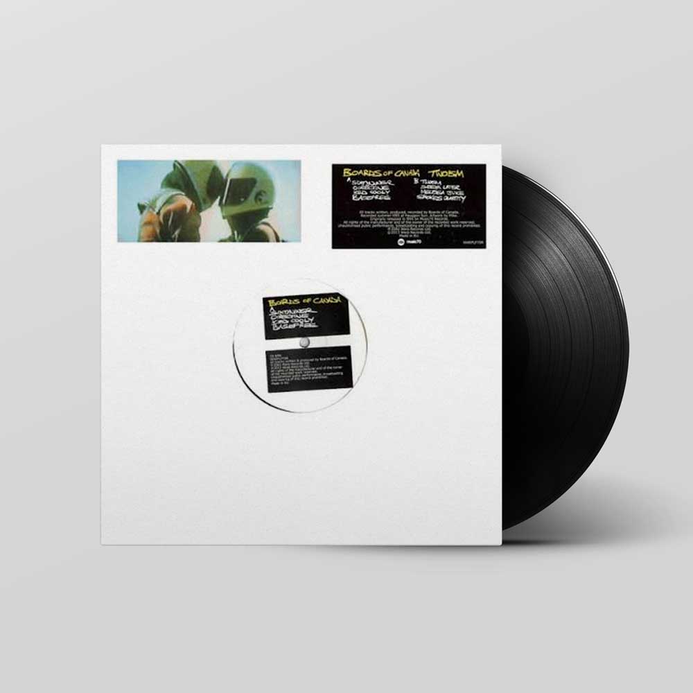 Boards of Canada - Twoism (Vinyl LP) A vinyl record partially pulled from its white sleeve, showing the back of the packaging with printed artwork and track information, plus the black record itself on a light gray background.
