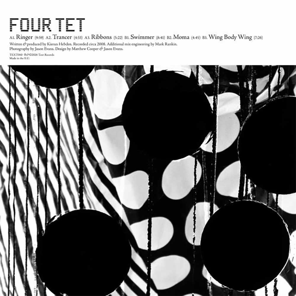 Four Tet - Ringer (Vinyl LP Expanded) Album cover for Four Tet's 'Ringer' album LP, featuring a black and white abstract photograph of hanging circular elements against a white background with the title 'FOUR TET' and track listing text at the top.