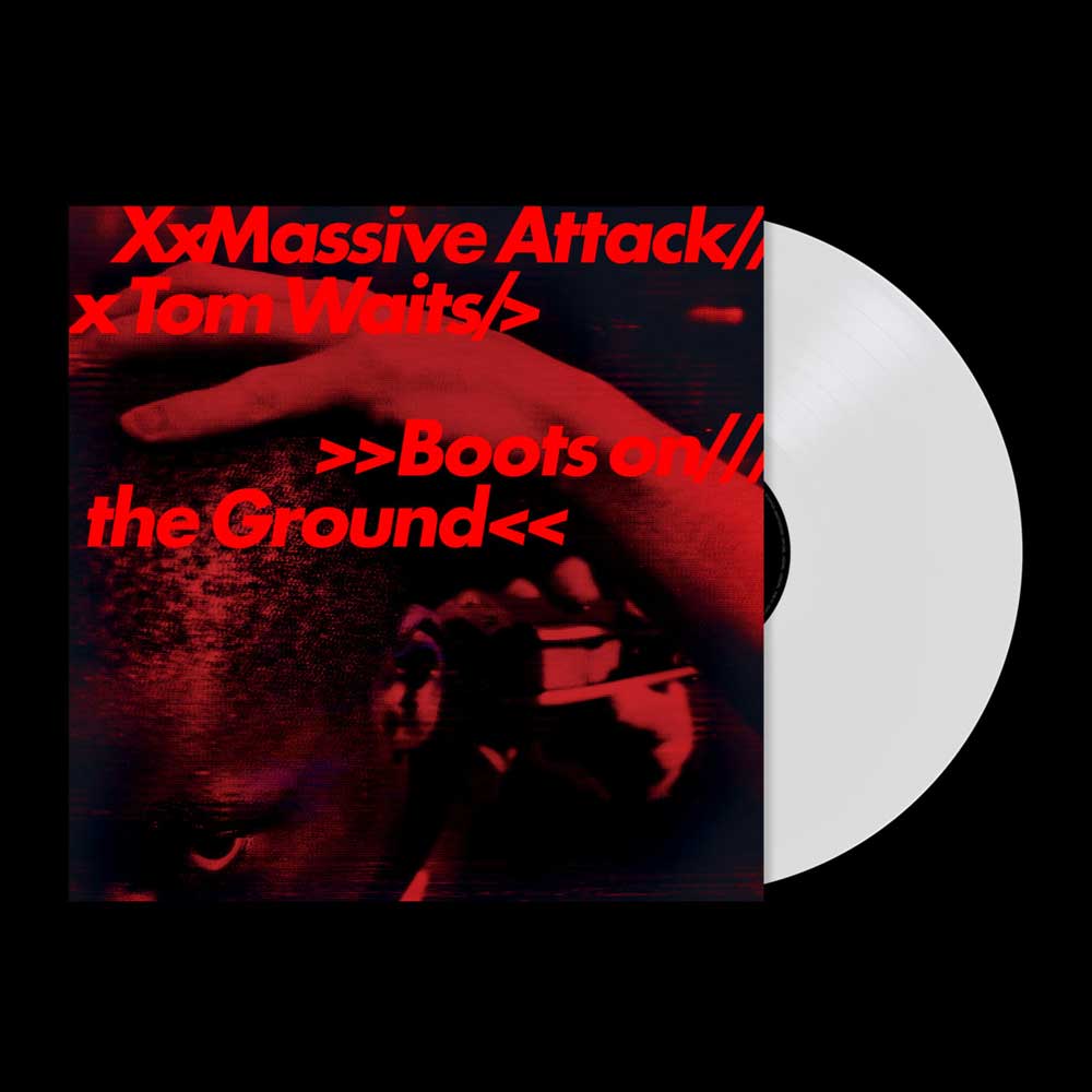 Massive Attack & Tom Waits - Boots on the Ground (Vinyl LP Random Red/White/Blue 180g) A vinyl record partially pulled from its album cover, shown on a black background. The cover features a dark red and black photo of a person with bold red text reading 'XxMassive Attack// xTom Waits// >>Boots on// the Ground<<'.