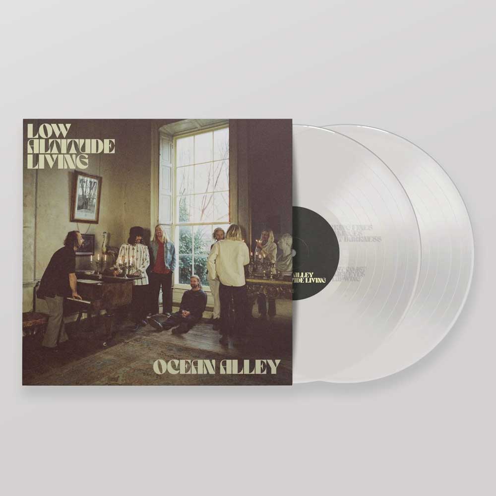 Ocean Alley - Low Altitude Living (Vinyl 2LP Clear). Ocean Alley's 'Low Altitude Living' vinyl record 2LP with a clear white record partially pulled from its illustrated sleeve, set against a neutral light grey background.