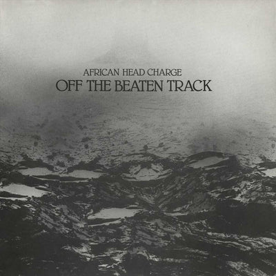 African Head Charge - Off The Beaten Track (Vinyl LP) Album cover for 'Off The Beaten Track' by African Head Charge, featuring a black and white photograph of a rugged mountain landscape with the text centered near the top.