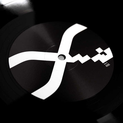 Alva Noto - Xerrox Vol. 5 (Vinyl 2LP) A close-up of a black vinyl record with the bold Xerrox Vol 5. white abstract logo printed across the center label.