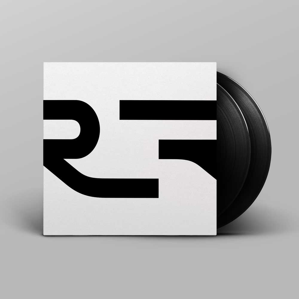 Alva Noto - Xerrox Vol. 3 (Vinyl 2LP) A vinyl record partially pulled from a square white sleeve with the Xerrox Vol 3 abstract bold black lettering, shown on a light grey background.