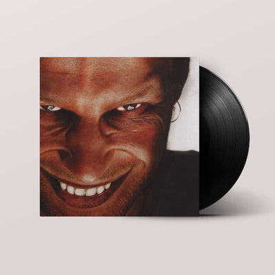Aphex Twin - Richard D. James Album (Vinyl LP 180g) Record album cover showing face on cover with black vinyl record sliding out of standard sleeve.
