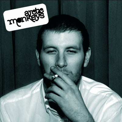 Arctic Monkeys - Whatever People Say I Am, That's What I Am Not (Vinyl LP) Album cover with a person smoking, featuring the Arctic Monkeys logo.