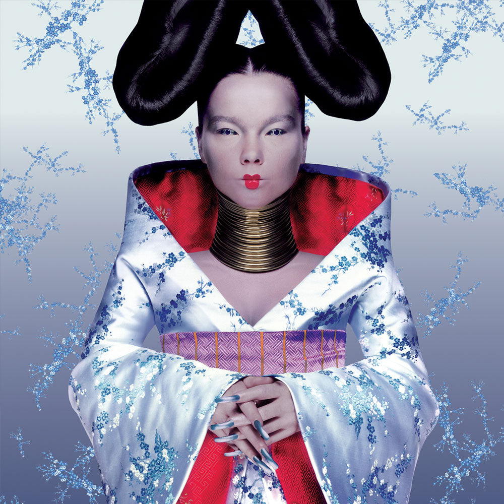 Björk - Homogenic (Vinyl LP) Person in a white and red outfit with black hair against a light blue background