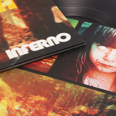 Boards Of Canada - Inferno (Vinyl 2LP) A vinyl record partially pulled from its sleeve, showing the album cover titled 'Inferno' with a fiery orange and black artwork and a portrait of a woman on the record sleeve.