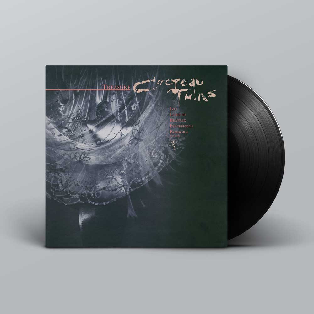 Cocteau Twins – Treasure (Vinyl LP). A vinyl record partially pulled from its sleeve, shown on a light grey studio background. The album cover is dark and black with a ghostly illustration and the title 'Cocteau Twins - Treasure' in a pale handwritten font.