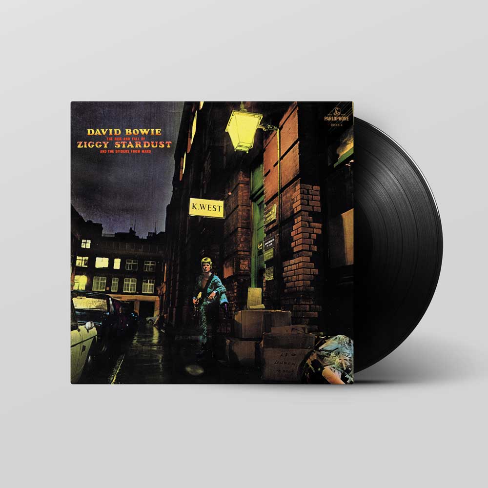 David Bowie - The Rise and Fall of Ziggy Stardust and the Spiders from Mars (Vinyl LP) David Bowie's 'Ziggy Stardust' vinyl record album with its black record partially pulled from the sleeve, set against a neutral gray background.