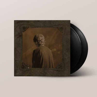 Ethel Cain - Willoughby Tucker (Vinyl 2LP) A vinyl record partially pulled from its sleeve, showing the album cover art of a sepia-toned portrait of a person from behind, with two black records visible against a light beige background.