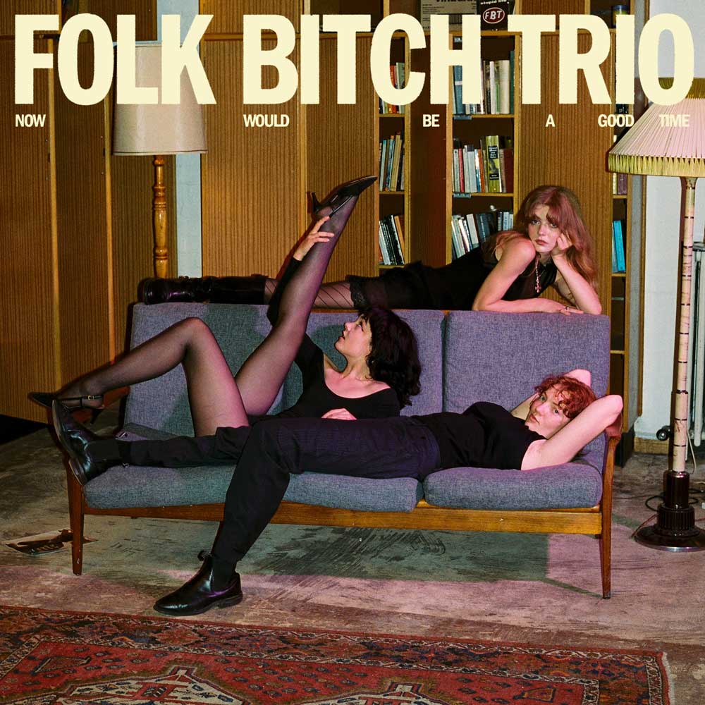 Folk Bitch Trio - Now Would Be A Good Time (Vinyl LP Sky Blue Opaque) Album cover with three people on a couch and text 'Folk Bitch Trio' at the top.