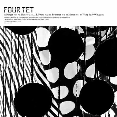 Four Tet - Ringer (Vinyl LP Expanded) Album cover for Four Tet's 'Ringer' album LP, featuring a black and white abstract photograph of hanging circular elements against a white background with the title 'FOUR TET' and track listing text at the top.