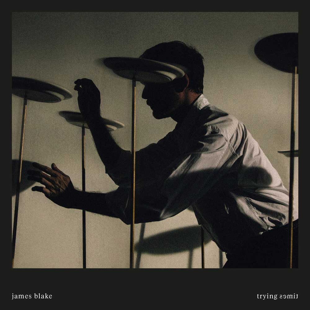 James Blake - Trying Times (Vinyl 2LP White) Album cover with a silhouette of a person interacting with shadows, featuring the artist 'James Blake' and album title 'Trying 2smile'.
