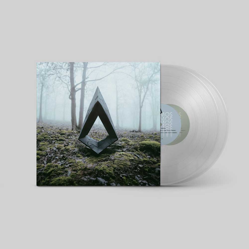 Kiasmos	- II Reworked (Vinyl 2LP Translucent) A vinyl record partially pulled from its sleeve, shown on a light grey background. The sleeve features a square photograph of a dark geometric sculpture on mossy ground in a misty forest.