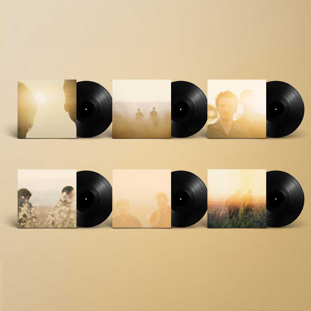 Six vinyl LP records partly pulled out of their photgraph printed slip cases
