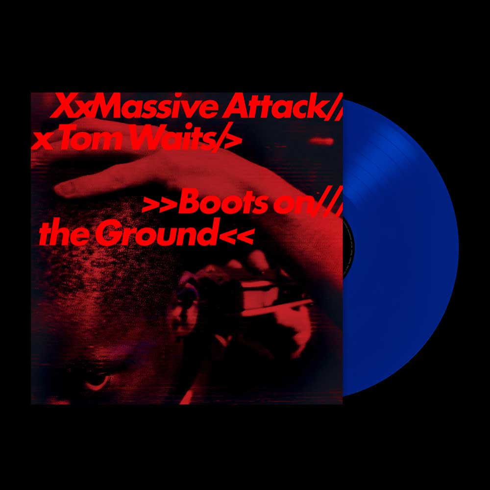 Massive Attack & Tom Waits - Boots on the Ground (Vinyl LP Random Red/White/Blue 180g) A vinyl record partially visible behind a square album cover on a black background. The cover features a dark red-toned close-up image with red text reading 'XxMassive Attack x Tom Waits >>Boots on the Ground<<'.