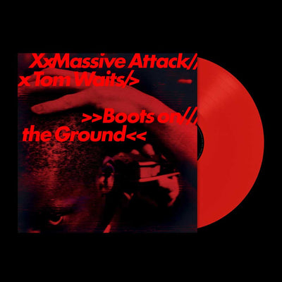 Massive Attack & Tom Waits - Boots on the Ground (Vinyl LP Random Red/White/Blue 180g) A vinyl record partially pulled from its square album cover, shown on a black background. The cover features a dark red and black close-up photo with bold red text reading 'XxMassive Attack// x Tom Waits// Boots on the Ground<<'.