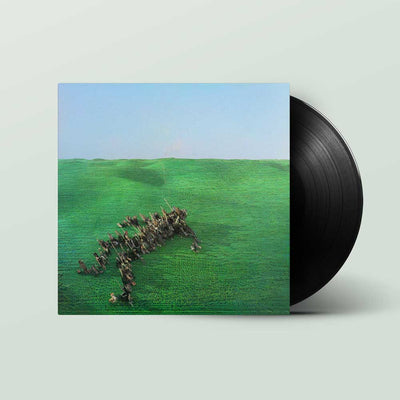 Squid - Bright Green Field (Vinyl 2LP) A vinyl record partially pulled from its sleeve, showing the album cover art of a marching band in a green field under a blue sky, on a light gray background.