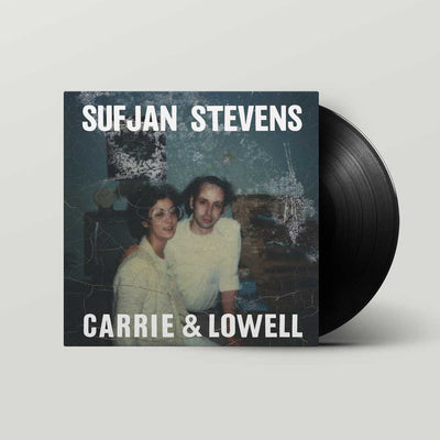 Sufjan Stevens - Carrie & Lowell (Vinyl LP) A vinyl record partially visible behind its square album cover. The cover shows a vintage-style photo of a couple with the text 'SUFJAN STEVENS' at the top and 'CARRIE & LOWELL' at the bottom.